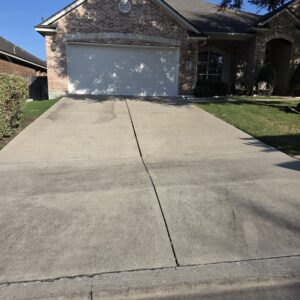 Driveway cleaning in Austin, TX before pressure washing service