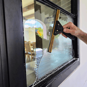 Professional window cleaning process in Austin, TX using hand-cleaned squeegee methods